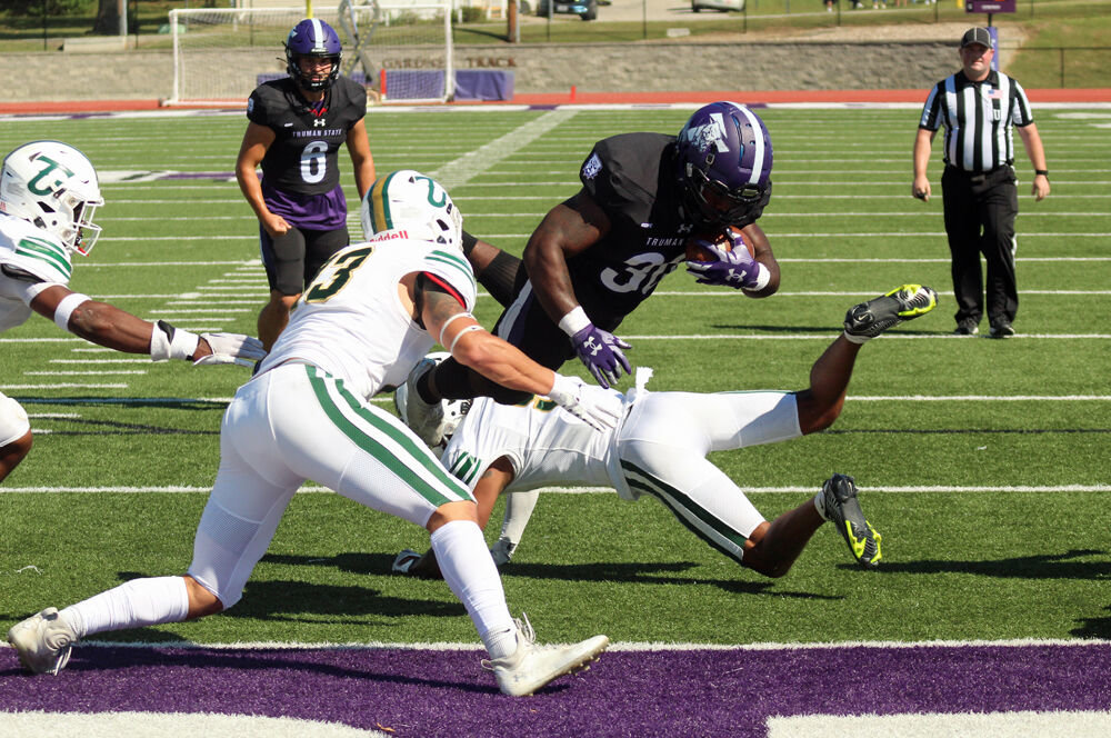 Truman State running back Denim Cook dives into the endzone for a second-quarter touchdown against Tiffin on Sept. 24. 