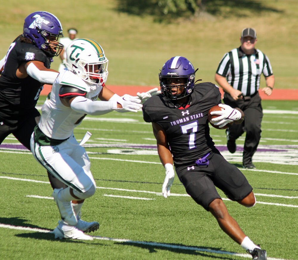 Truman State running back Shamar Griffith runs by a Tiffin defender in the game on Sept. 24. 
