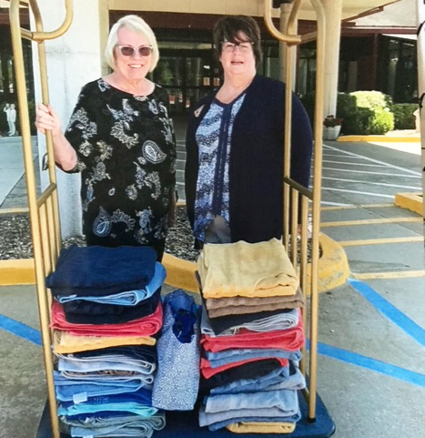 Mary Ann Farmer presents the lap robes to Kathy Winkelman of the Mexico Veterans Home.