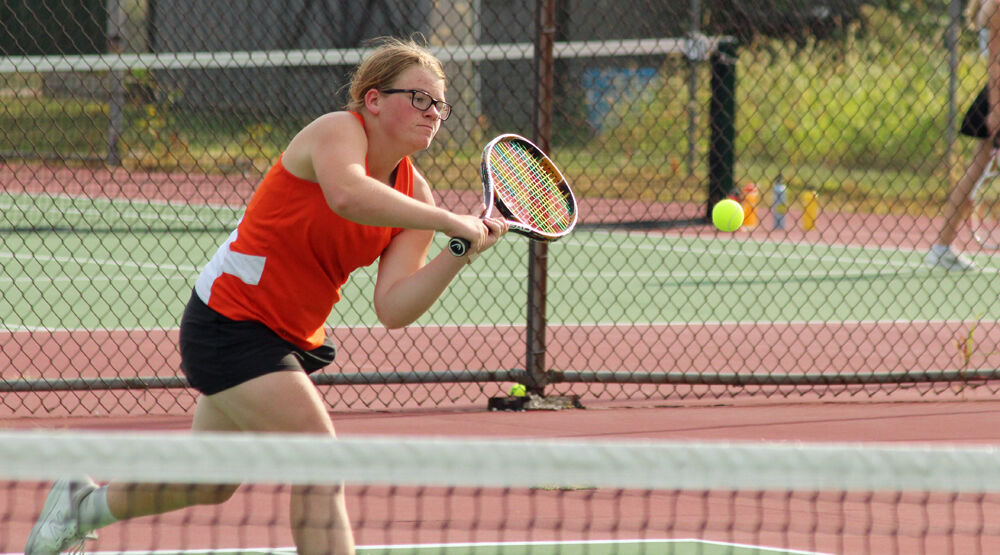 Kirksville junior Madisynn Crawford charges in for a shot in a singles match. 
