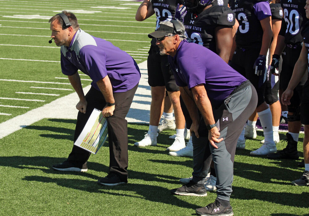 Truman State head coach Gregg Nesbitt (right) and offensive coordinator Jason Killday watch from the sidelines during the game against Tiffin on Sept. 24. 