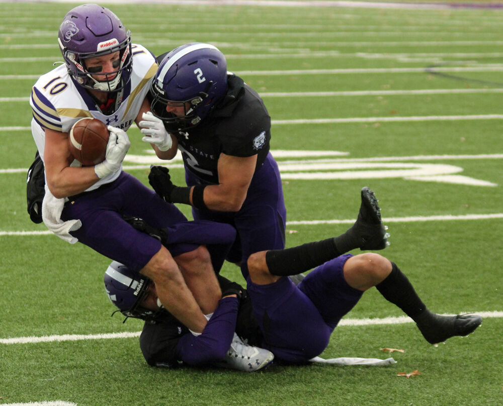 Truman defensive backs Ben Watson (2) and Ryan Olivas bring down a McKendree ballcarrier in the game on Nov. 5. 