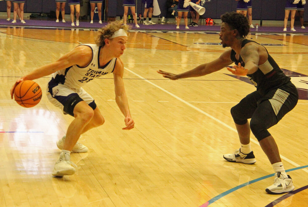 Truman guard Elijah Hazekamp makes a move against an Indianapolis defender in the game on Nov. 28. 