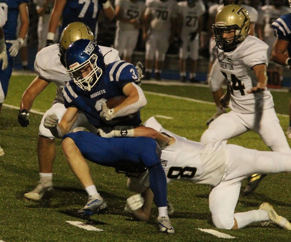 Putnam County running back Blaine Perkins is tackled by a Trenton defender in the game on Sept. 16. 