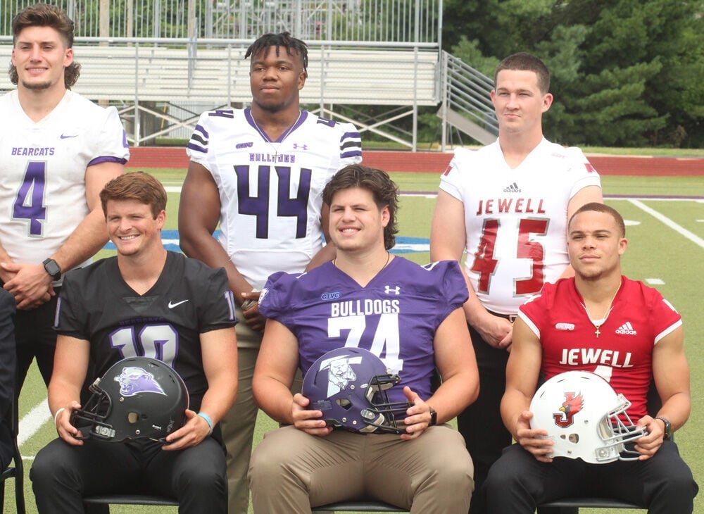 Truman State offensive lineman Justin Watson (74) and linebacker Ulysses Ross (44) pose for photos next to players from Southwest Baptist ad William Jewell during the GLVC Football Kickoff event held July 29 at McKendree University in Lebanon, Illinois. 