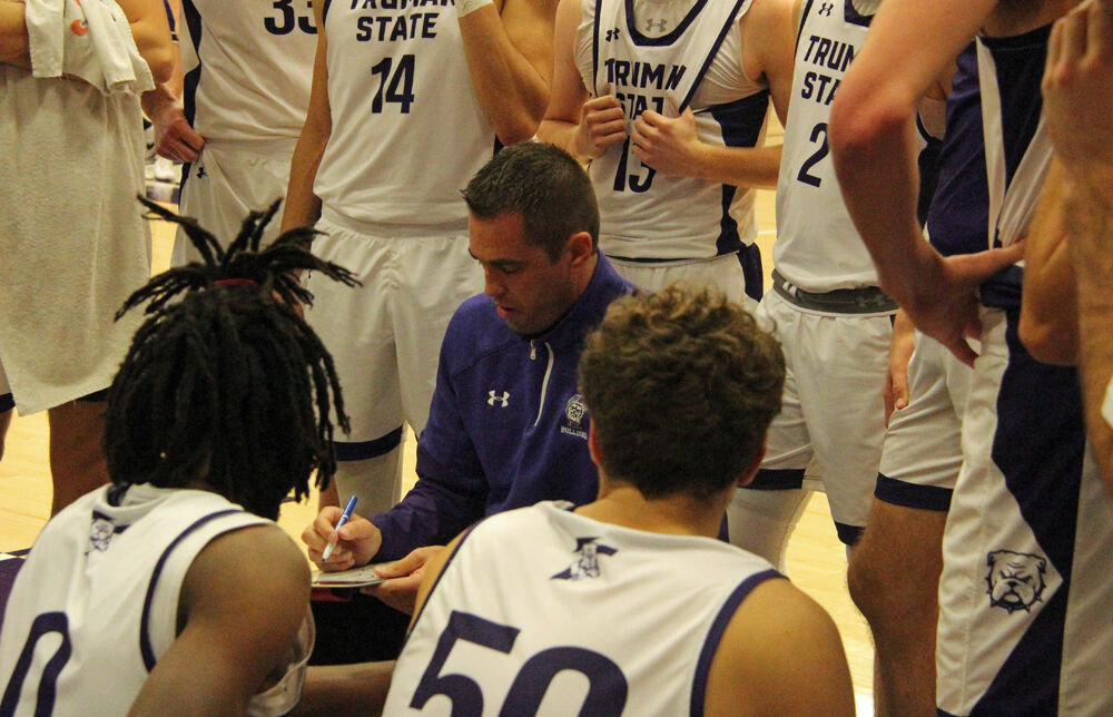 Truman head coach Jeff Horner draws up a play during a timeout against Indianapolis on Nov. 28. 