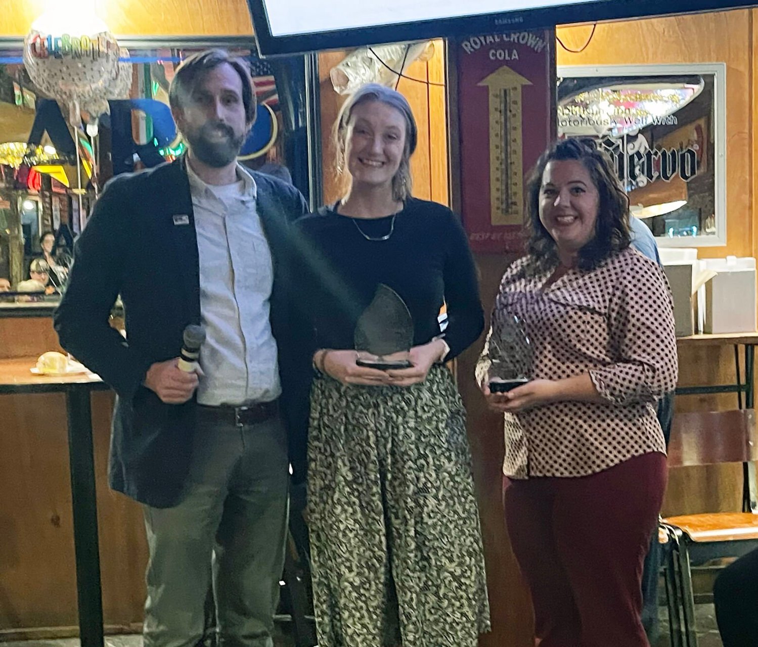 Ted Frushour, 2022 United Way President presents Crystal Campaign Awards to Ramey Weichelt, 2023 Campaign Chairperson and Co-Chair Amanda Selby.


 