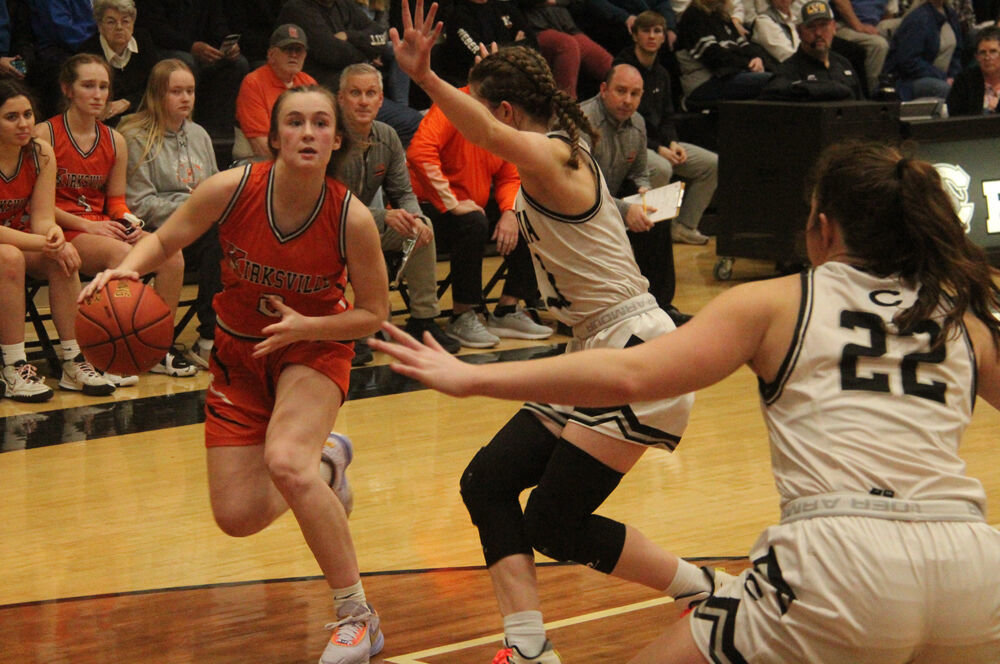 Kirksville sophomore Elli Porter drives on Centralia defenders in the game on March 2. 