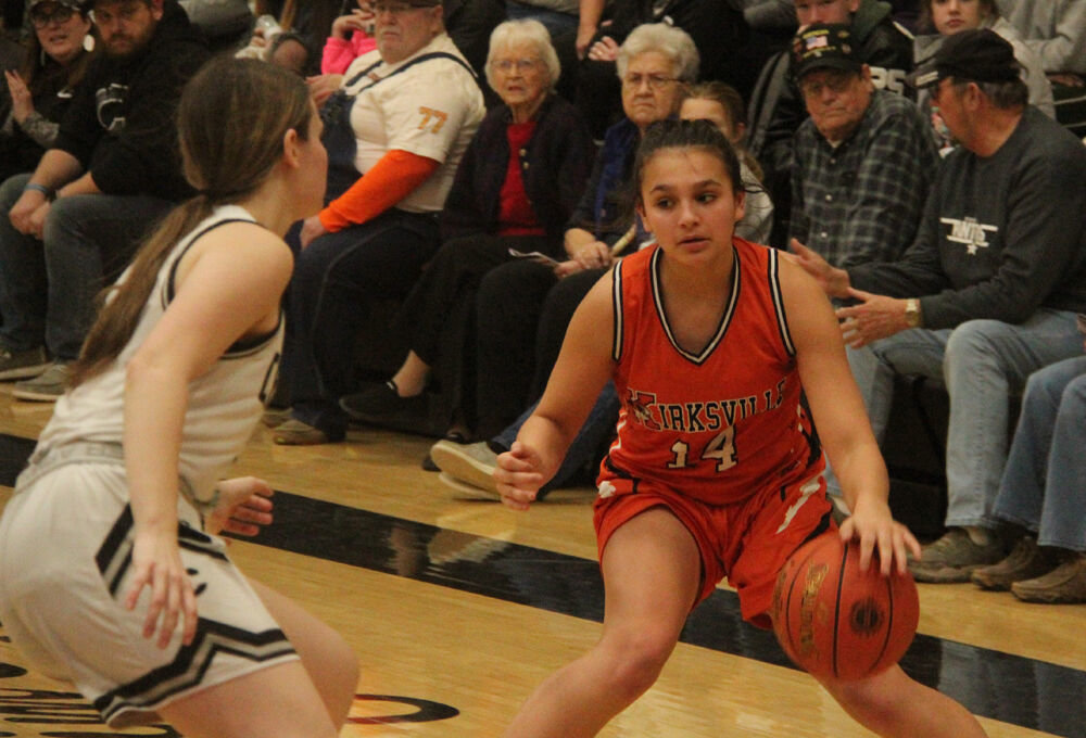 Kirksville sophomore Paishynce Fouts looks to get by a Centralia defender in the game on March 2. 