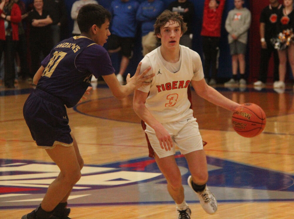 Kirksville senior Isaac Danielson brings the ball up the court in the game against Hallsville on March 3. 