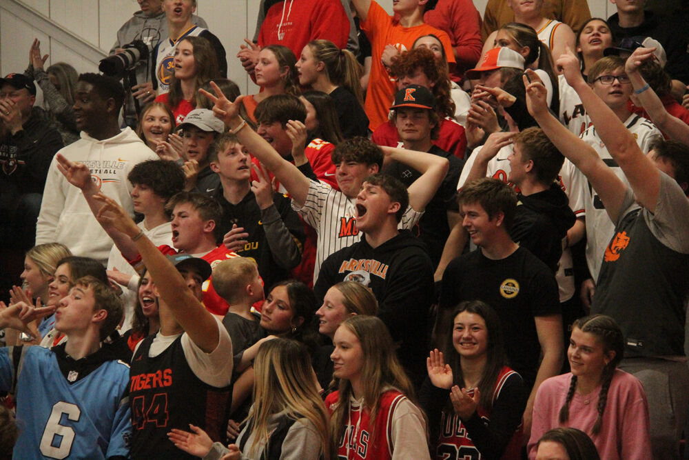 The Kirksville student section celebrates a three pointer from sophomore Cole Kelly in the game against Hallsville on March 3. 