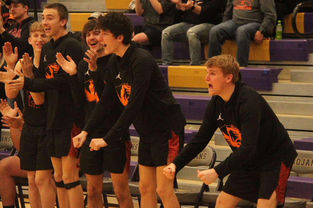 The Kirksville bench celebrates a basket from the Tigers in the sectional game against Lutheran St. Charles on March 6. 