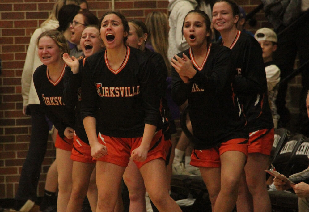 Players on the Kirksville bench celebrate a basket in the district semifinal game against Centralia on March 2. 