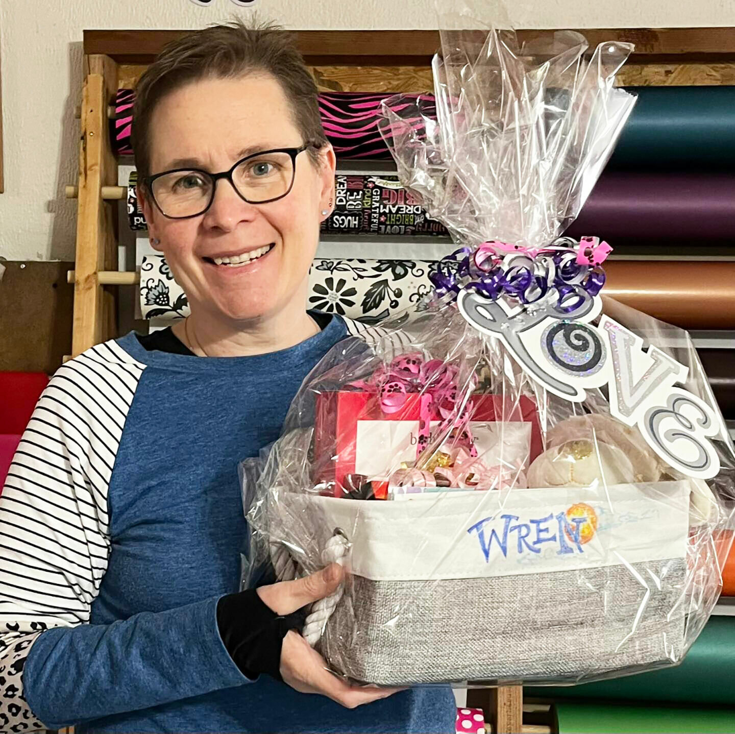 Shannon VonAllmen, executive director of Birthday Blessings, with a care package for a foster teen living in a residential facility. The nonprofit sends these out seasonally to add an emotional boost to these vulnerable kids.