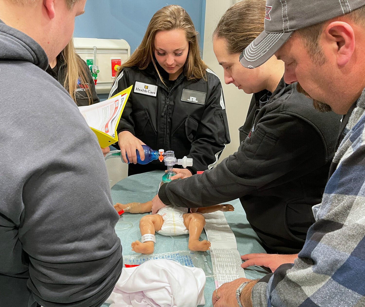 Adair County Ambulance first responders train on a baby mannequin inside the state-of-the-art mobile simulation unit provided by the University of Missouri School of Medicine and the University of Missouri Extension. 