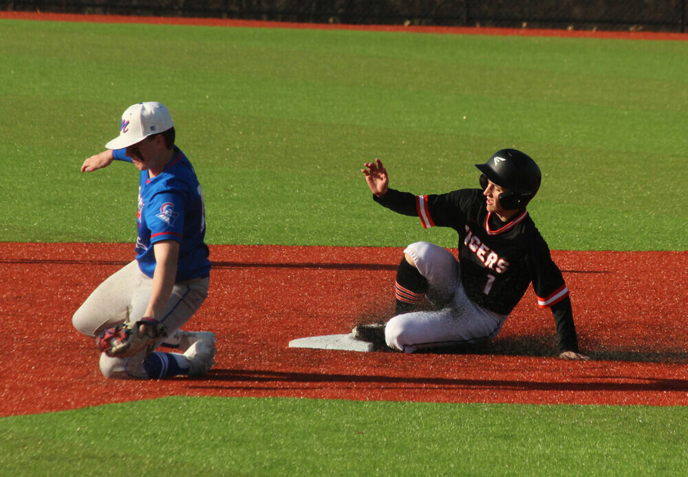 Kirksville sophomore Carson Kelly slides safely into second base on a steal attempts against Moberly on March 27. 