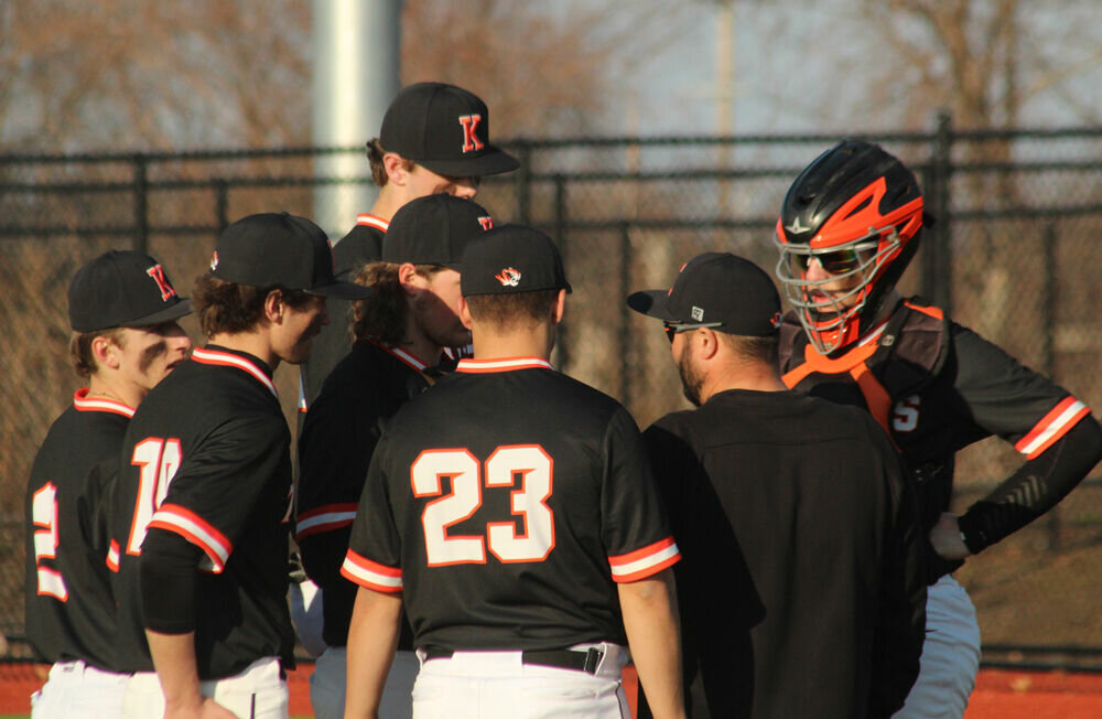 Kirksville head coach Derek Allen holds a meeting on the mound during the game against Moberly on March 27. 
