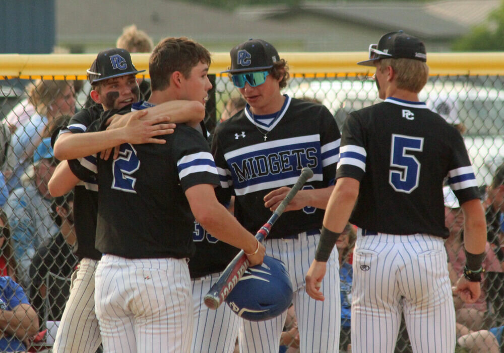 Putnam County baseball players hug following the final out of their loss to Salisbury on May 24. 