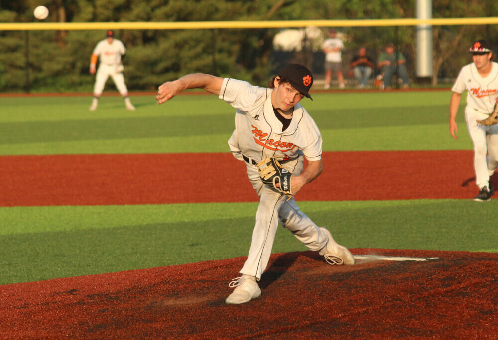 Macon senior Logan Petre sends a pitch toward home in the game against Fulton on May 23. 
