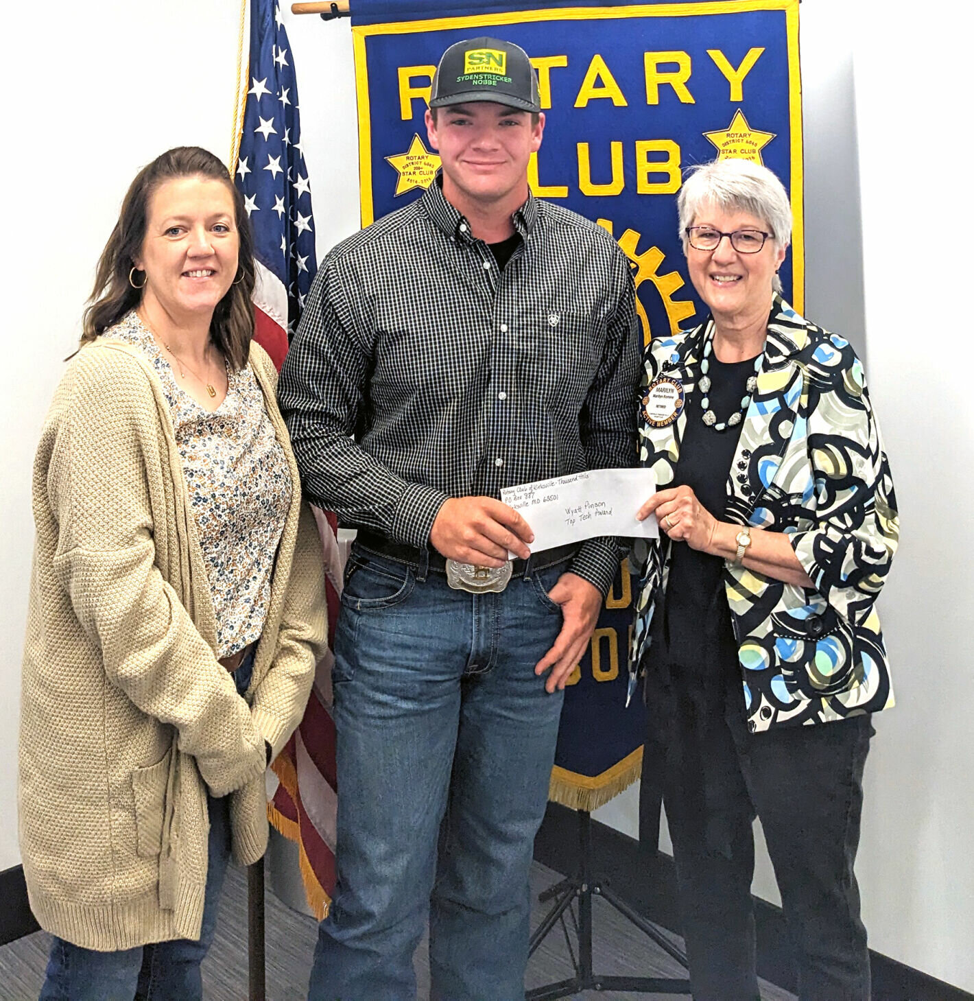 Wyatt Pinson (center) and his mother, Jessie Pinson (left) with Thousand Hills Rotary Club President Marilyn Romine.