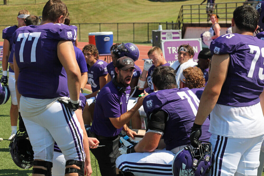 Truman offensive line coach Mack Helms addresses the team on the sideline during the game against South Dakota Mines on Sept. 9. 