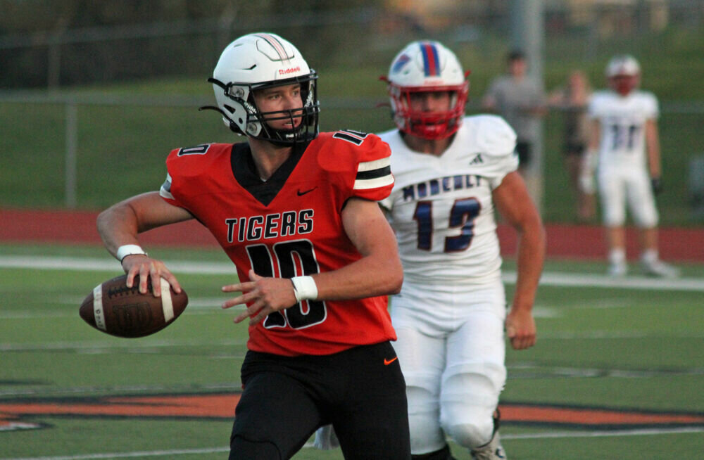 Kirksville quarterback Ryder Lyons looks to throw on the move in the game against Moberly on Sept. 15. 