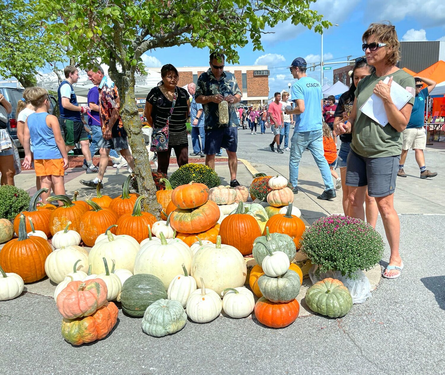 Taking inventory of the gourds and pumpkins at the Red Barn Arts and Crafts Festival.