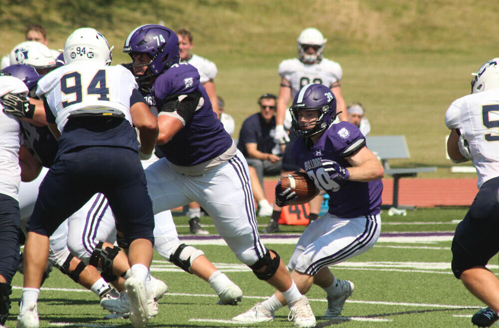 Truman running back Mason Huskey looks to run behind his blockers in the game against South Dakota Mines on Sept. 9.