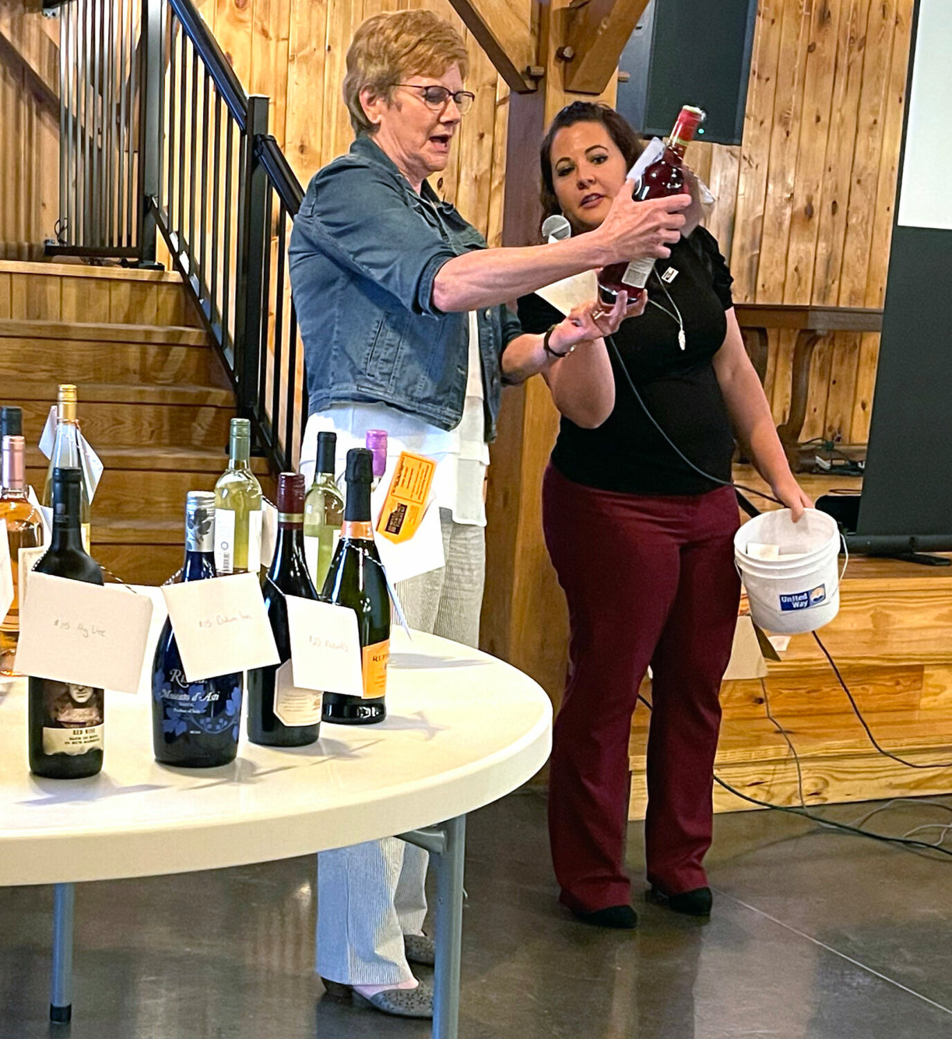 A winner chooses a bottle of wine at the United Way of Northeast Missouri 2024 Campaign Kickoff &amp; Cork Pull.