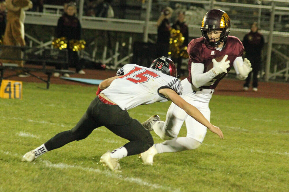 Schuyler County senior Mayson Humphrey looks to evade Knox County senior Reice Miller in the game on Nov. 3. 