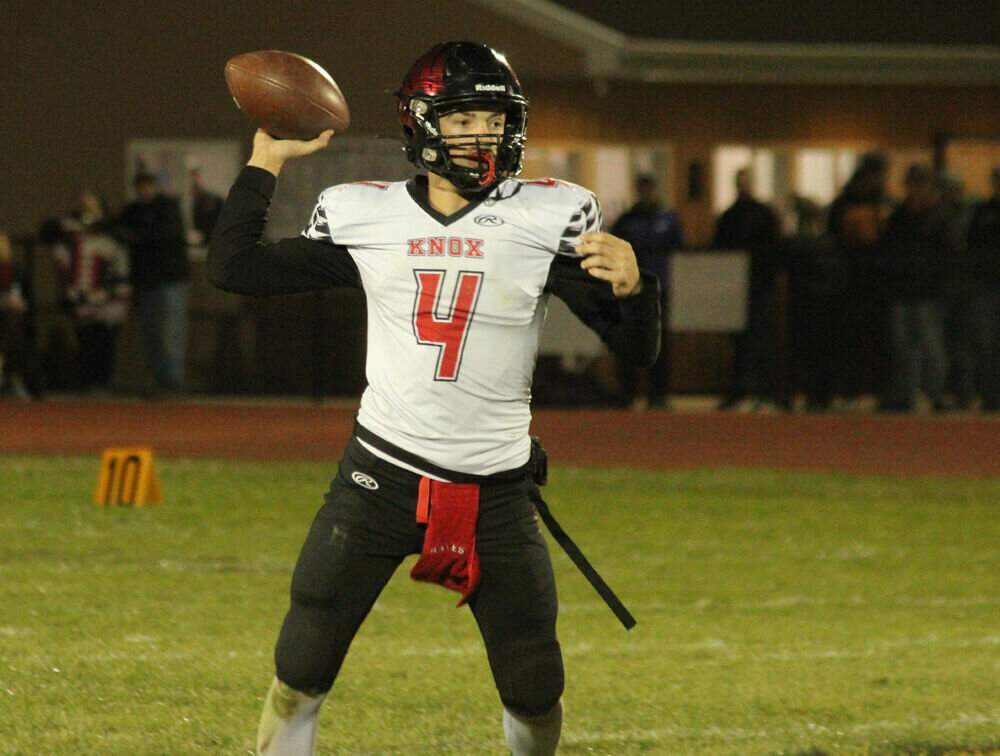 Knox County quarterback Collin Hayes rolls out to pass against Schuyler County on Nov. 3. 