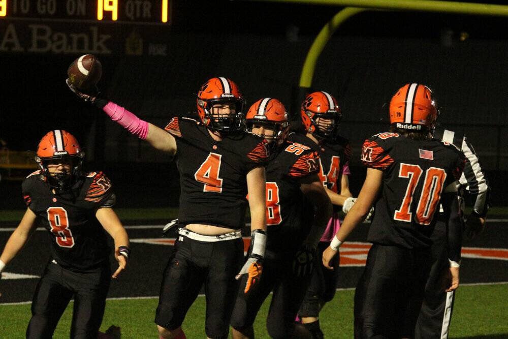 Macon senior Jonathan Bray (4) celebrates a fumble recovery in the game against Monroe City on Oct. 13. 