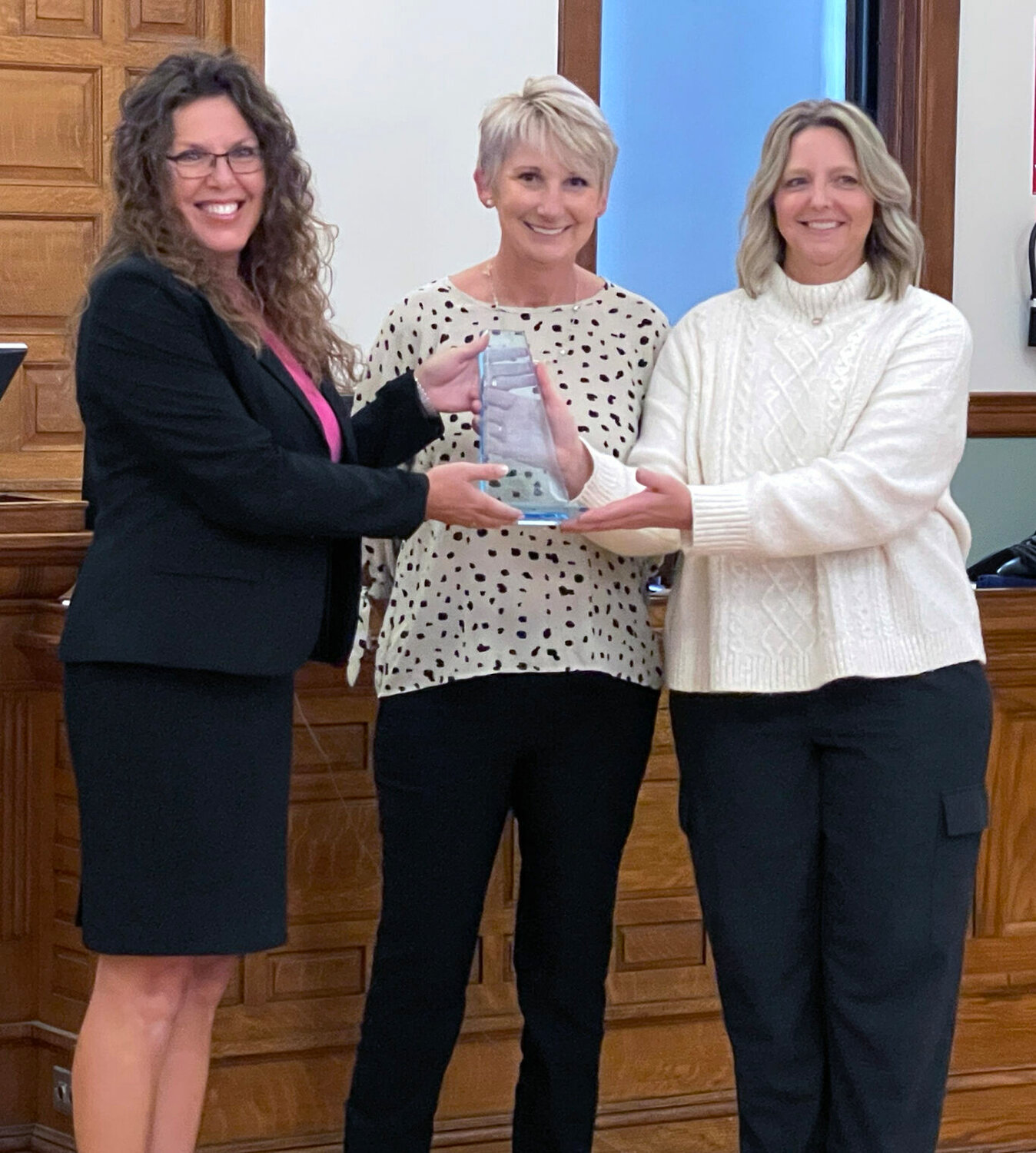 Attorney Sherry Darling (left) receives an award from Andrea Applebury, District Administrator for District 3, and Lacy Craig, District 3, Unit Supervisor.