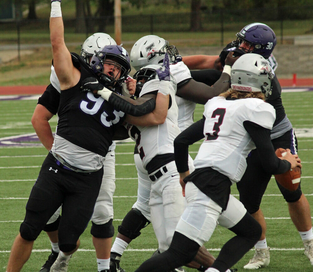 Truman defensive lineman Mason Crim fights through a block in the game against Indianapolis on Oct. 14. 