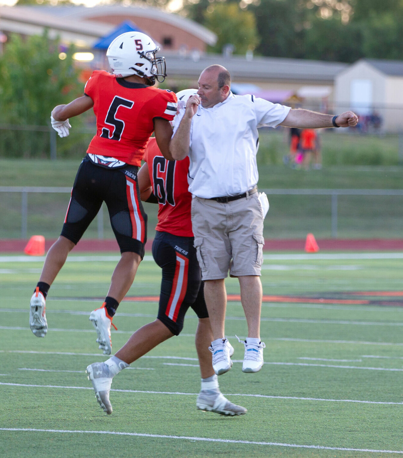 Kirksville head coach Kevin Krietemeyer celebrates a touchdown with Kendrick Hartman during the game against Chillicothe on Sept. 2, 2022. 