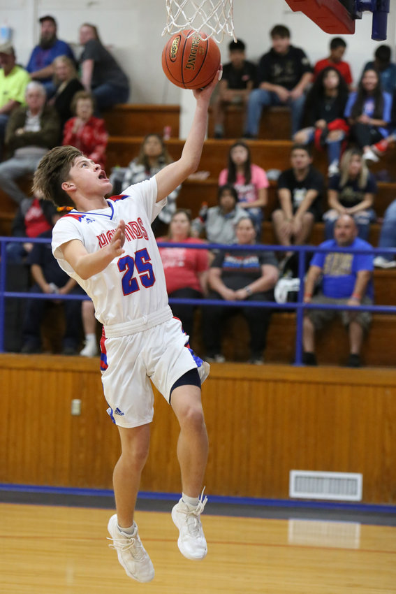 Nicholas Trevino with a fast-break layup for the Hounds in action last week.