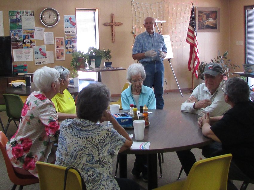 Director Jim Dillon with local residents at the Aging Center.