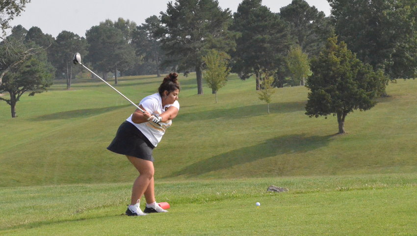 LCR photo/Alex Boyer  Lebanon senior Jalynn Allen hits a drive during a match. Allen led the way for the Lady 'Jackets at the OC tournament on Tuesday afternoon.