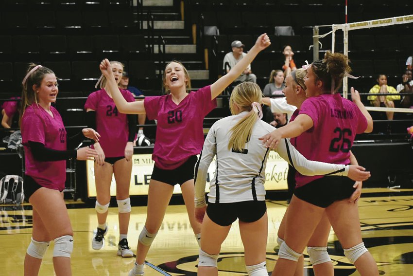 The Lebanon High School varsity volleyball team celebrates a point against the Waynesville Tigers on Tuesday night at Boswell Auditorium.&nbsp;