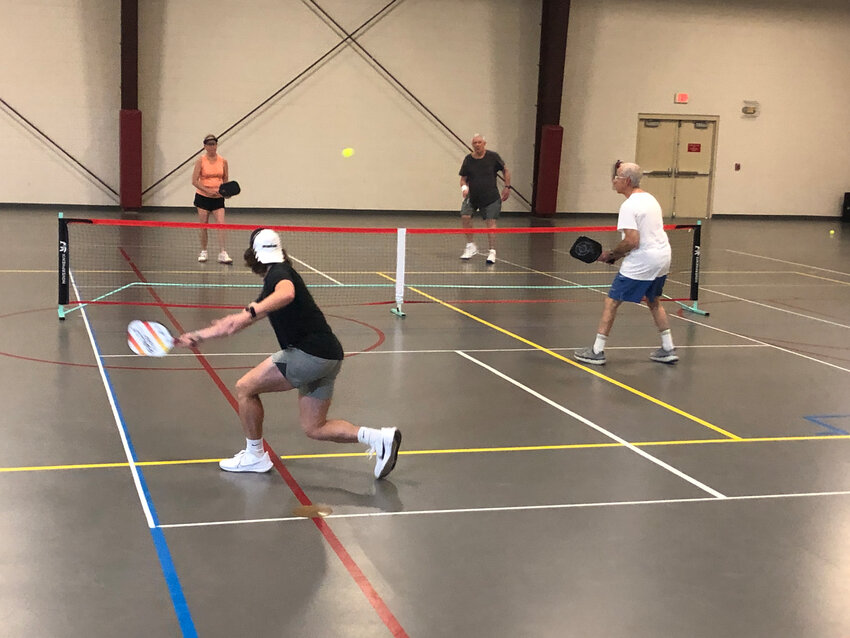 Pass Christian resident Mark Bridges (far right) is one of a number of locals who play pickleball almost daily at the Long Beach Senior Center.
