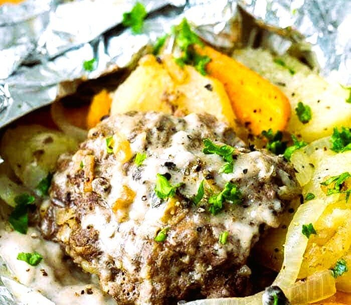 A delicous dinner of hamburger, potatoes and onions can be baked or grilled in a sturdy package of foil, eliminating the need for dishes, pans or anything else to wash.