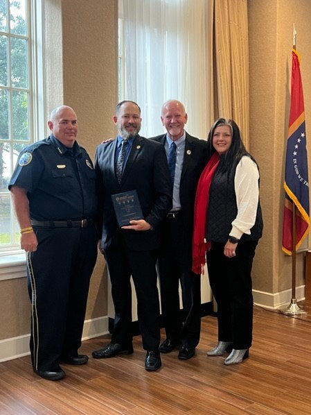 Pictured (l to r) are Long Beach Police Chief Billy Seal, 2022 Police Officer of the Year recipient Detective Brad Gross, Mayor George Bass, and Long Beach Chamber of Commerce Chair Melissa Rae Seymour.