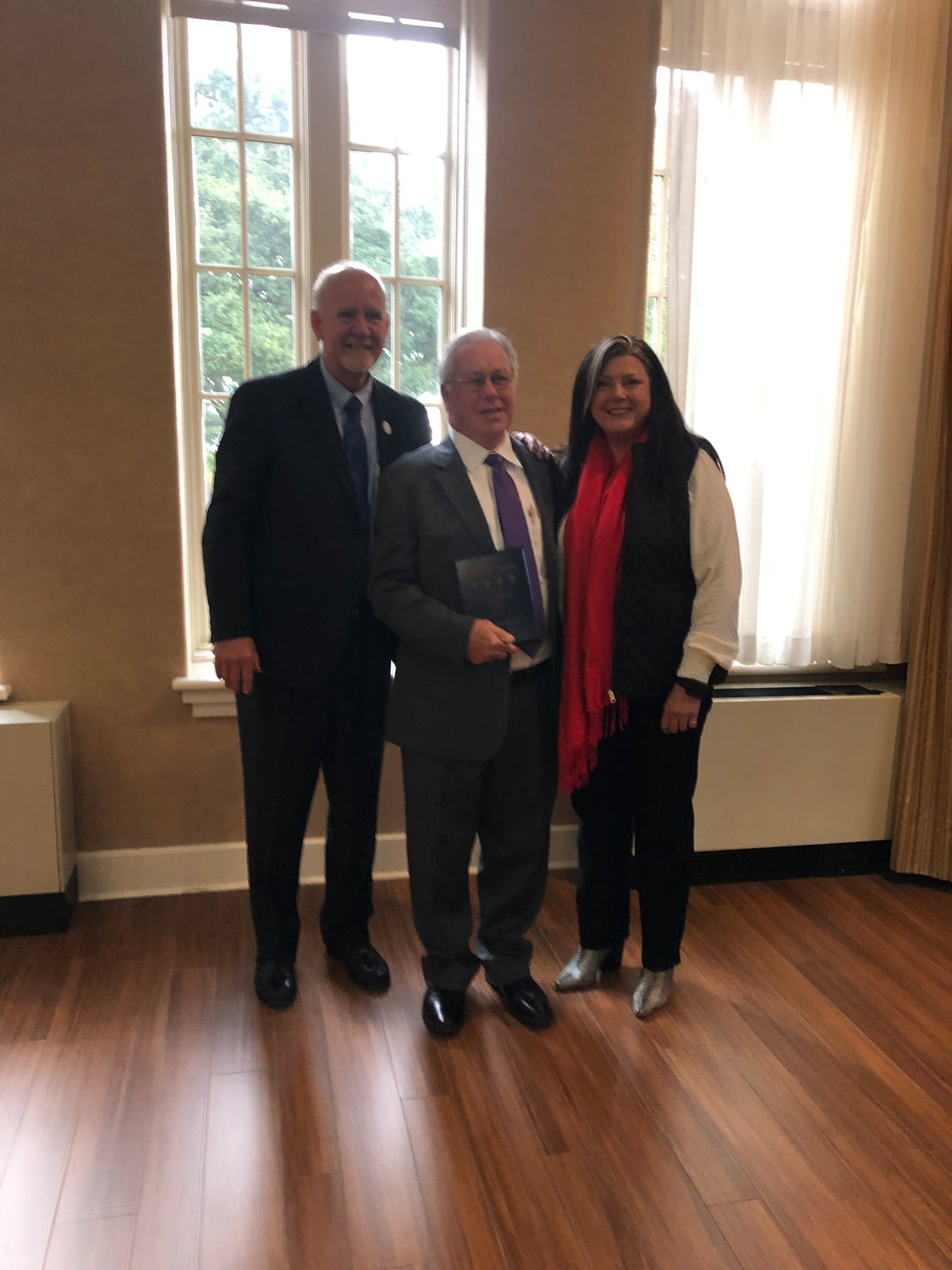 Pictured (l to r) are Mayor George Bass, 2022 Aline Doherty Citizen of the Year award recipient John Bull, and Long Beach Chamber of Commerce Chair Melissa Rae Seymour.
