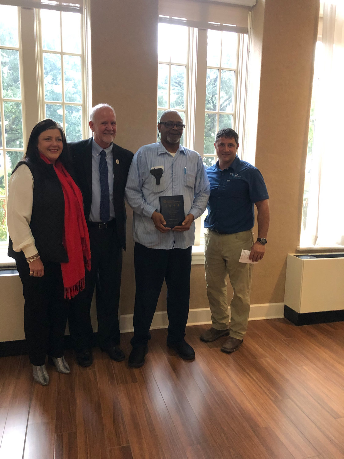 Pictured (l to r) are Long Beach Chamber of Commerce Chair Melissa Rae Seymour, Mayor George Bass, 2022 Utility Person of the Year award recipient Avery Taylor, and Joe Culpepper from h20 Innovation.