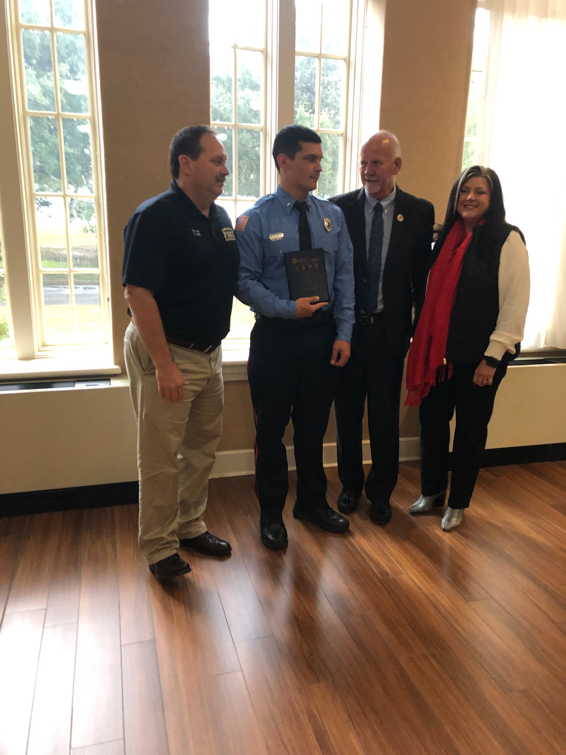 Pictured (l to r) are Long Beach Fire Department Chief Griff Skellie, 2022 Long Beach Firefighter of the Year award recipient Lee Jordan, Mayor George Bass and Long Beach Chamber of Commerce Chair Melissa Rae Seymour.
