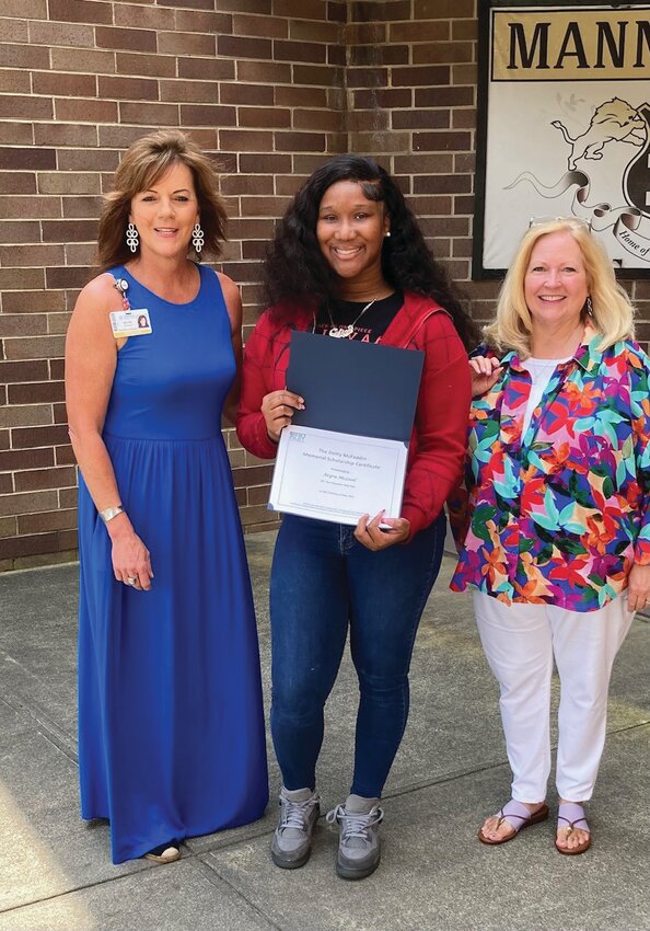 Lainey Baggette, center, of Laurence Manning Academy, is presented the Dotty McFadden Memorial Scholarship by Pilot Club members Neel Lesesne, left, and Marsha Thompson, right. The scholarship honors students entering the medical field and recognizes academic achievement and community service.
