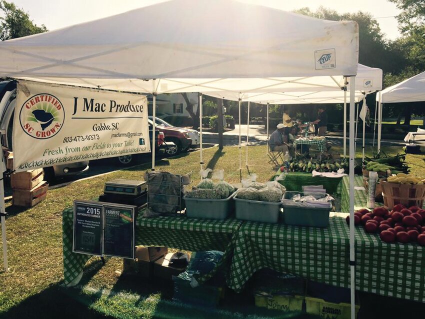 . JMac Produce sets up shop at the Manning Farmers Market, offering fresh butter beans, peas, sweet corn, tomatoes, and more. The family-run farm from Gable is a longtime favorite among local shoppers.