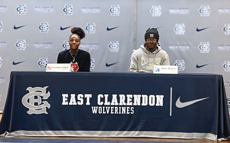 East Clarendon seniors Jasmyne Lloyd and Syrus Brown smile during their college signing ceremony. Lloyd will continue her basketball career at Newberry College, while Brown will wrestle for Allen University.