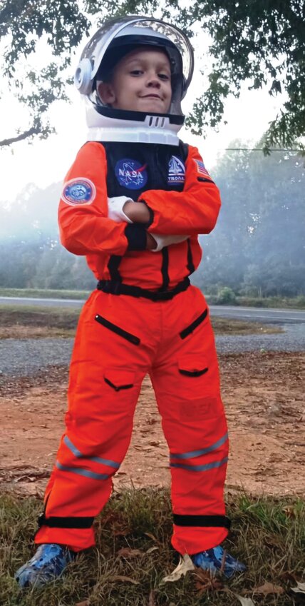 Isaac Thomas Parker, 8, dreamed of becoming an astronaut. He is pictured here proudly wearing his spacesuit, a reflection of his bright imagination and adventurous spirit.