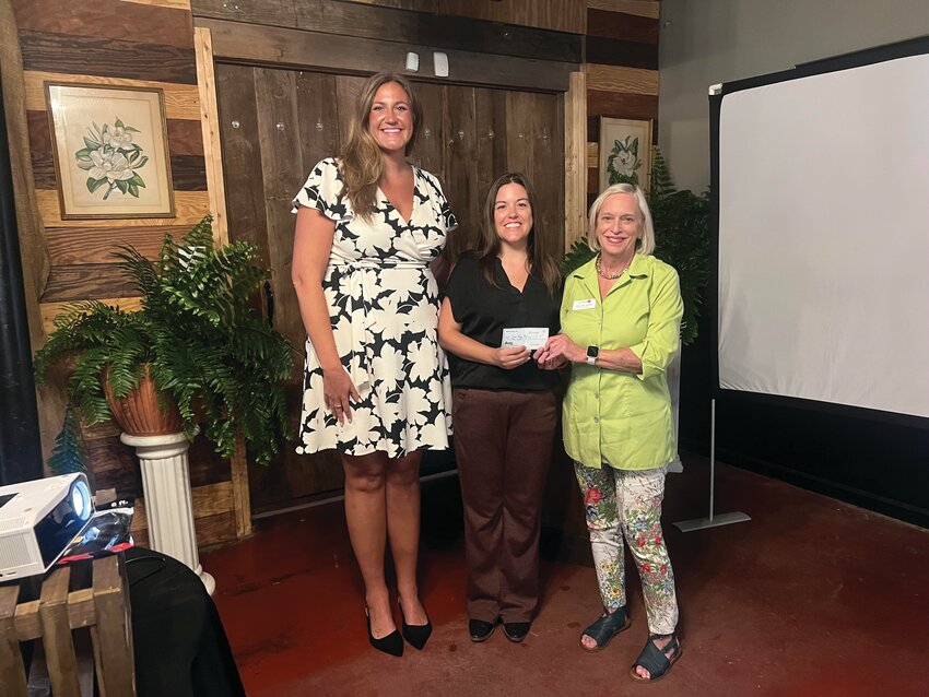 From left, Camp Happy Days Director of Development Mikaela Nichols, incoming Manning Rotary Club Sergeant-at-Arms Melissa Foust-McCoy, and Executive Director Cindy Hay Johnson pose for a photo after the club presented a donation to support Camp Happy Days’ year-round programming for children with cancer and their families.
